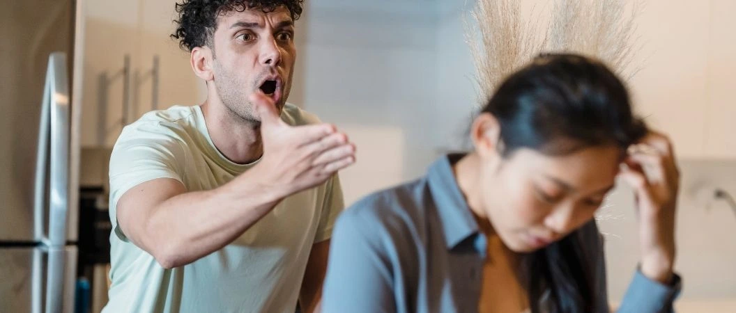 Man shouting at his wife showing disrespect and unhealthy communication in marriage